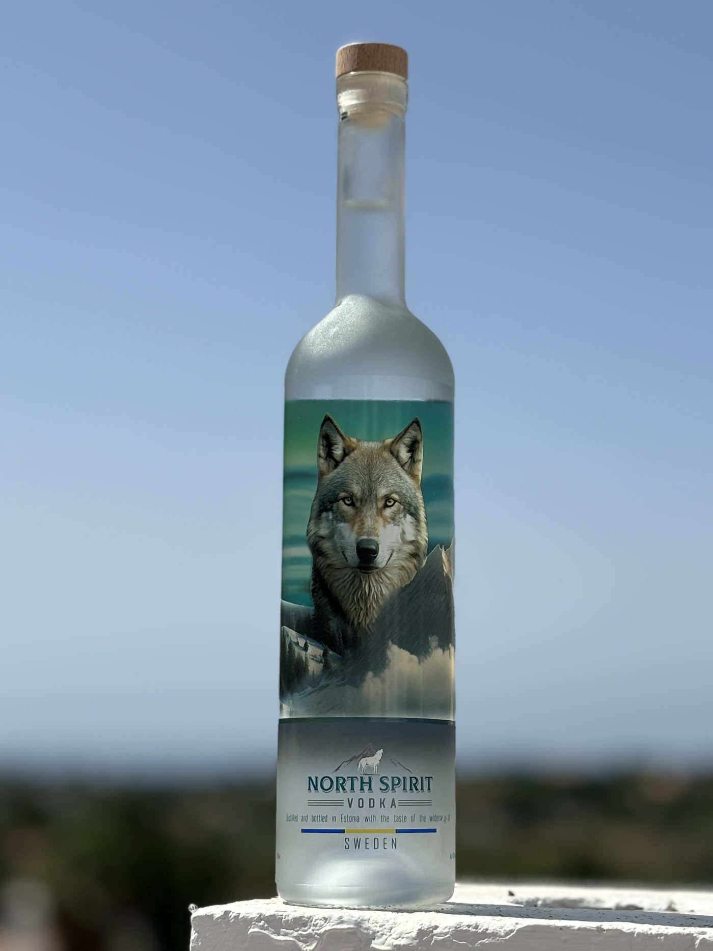 A bottle of North Spirit against a clear sky